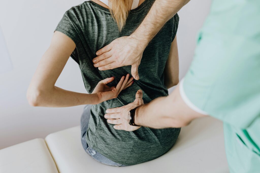 Doctor examining patient for failed back surgery syndrome