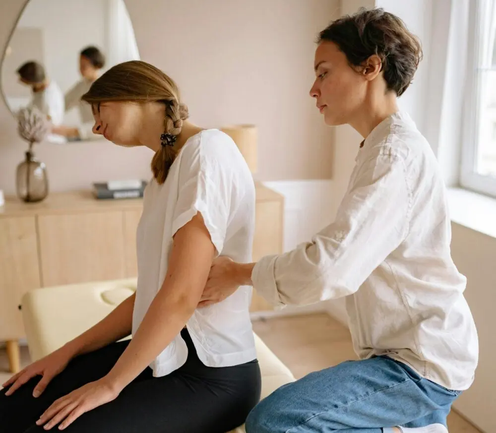 Woman experiencing chronic back and shoulder pain – concept of spinal cord stimulation